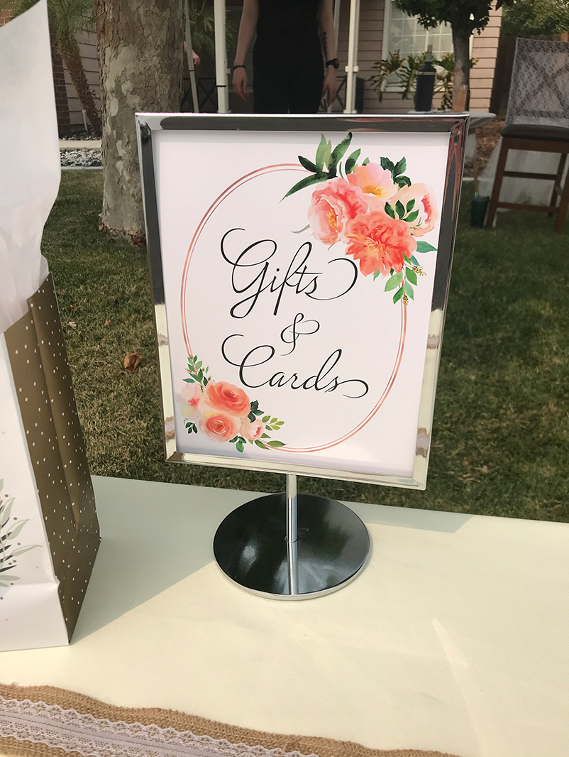 sign on a table that says Gifts and Cards